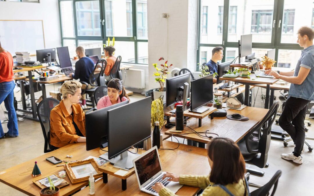Diverse Professionals Working In A Modern Open Plan Office