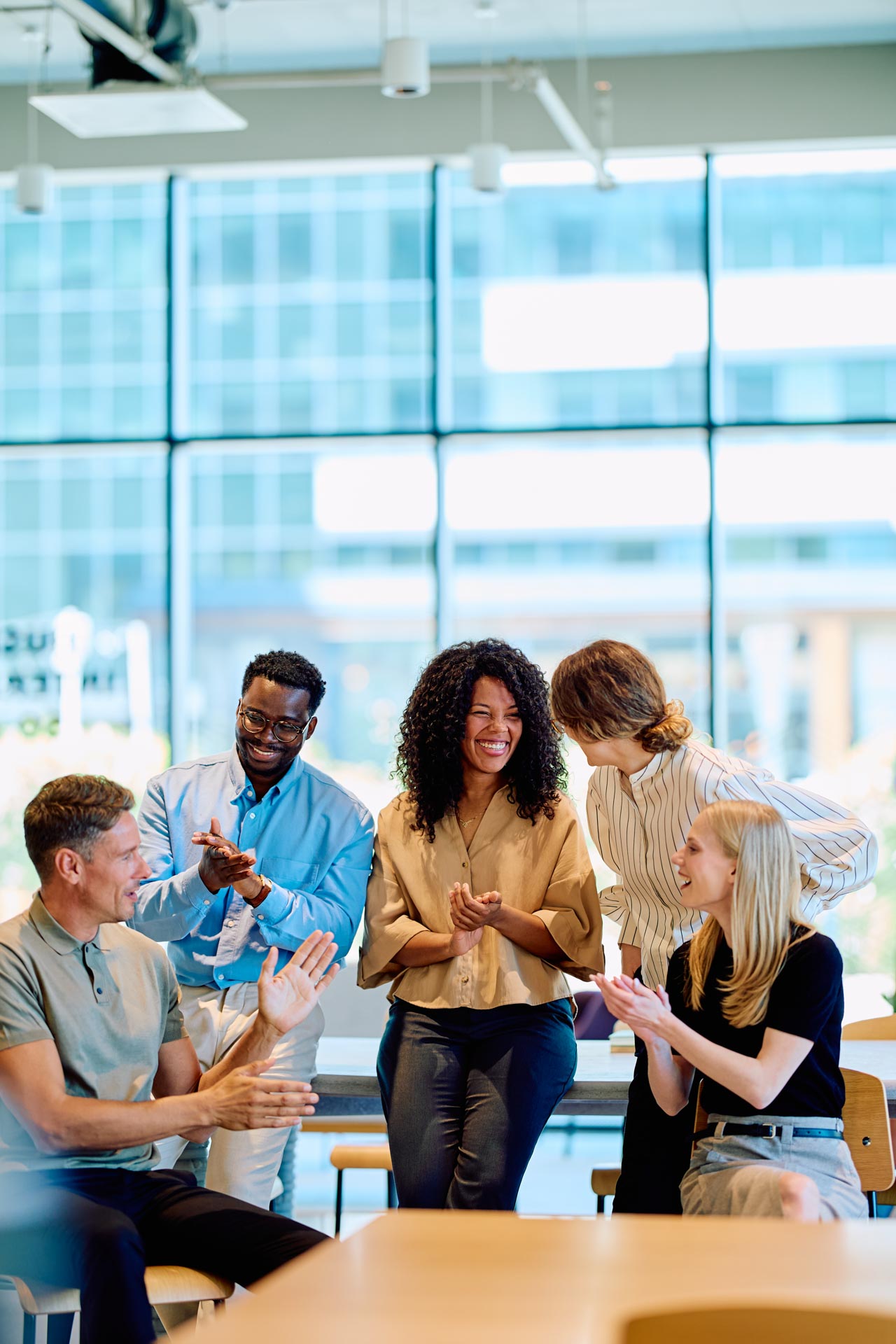 Diverse Business Team Clapping Celebrating Success In Office